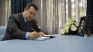 FDPM and MFA Dacic signs the book of condolences at the Embassy of Montenegro [3/7/2014] 