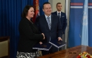Minister Dacic and Karla Robin Hershey sign agreement