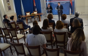 Minister Dacic and Karla Robin Hershey sign agreement