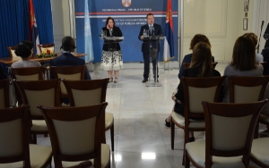 Minister Dacic and Karla Robin Hershey sign agreement